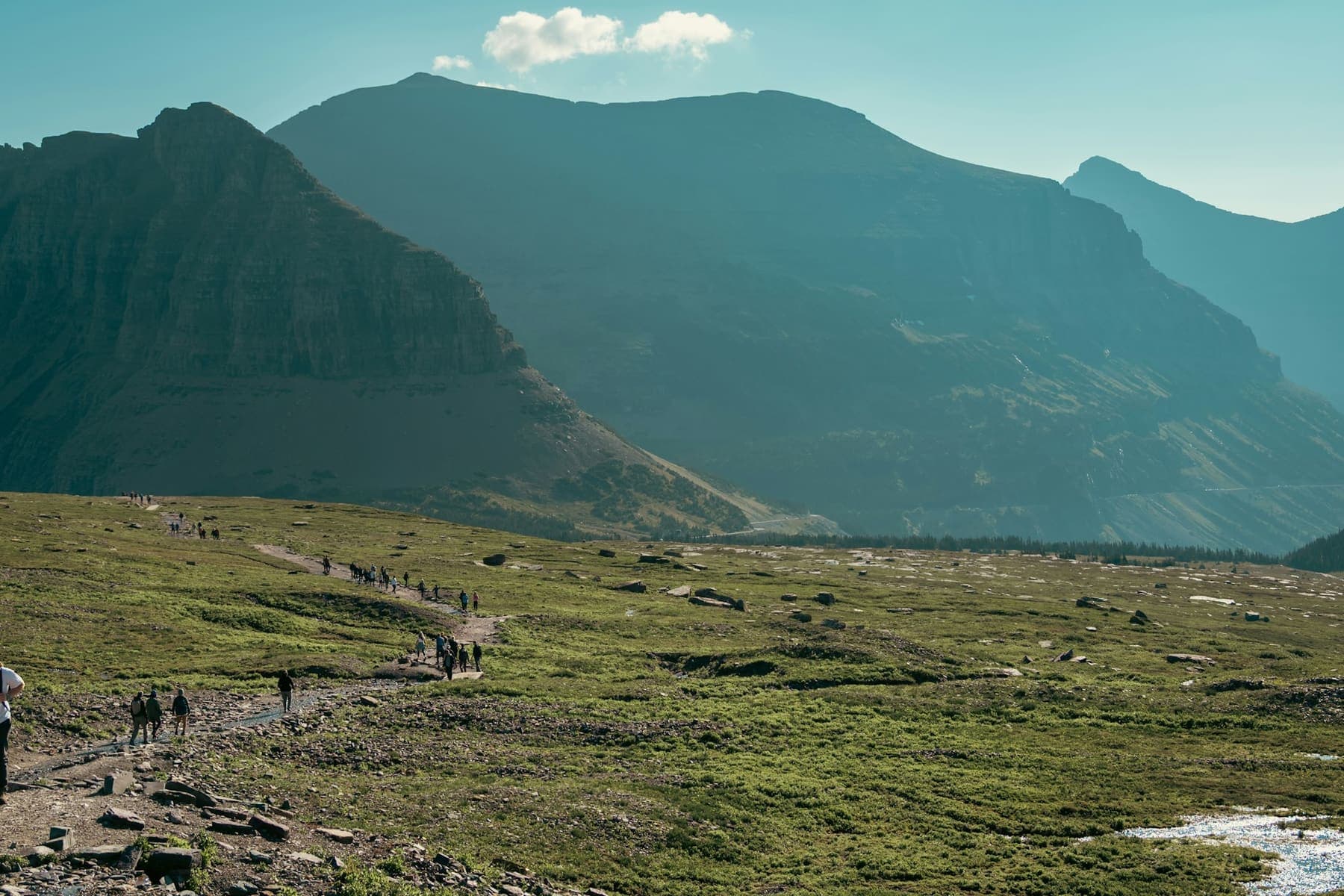 Travellers looking out over a mountain landscape